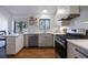 Bright kitchen area with wood flooring and white cabinets at 3594 Vinyard Way, Lawrenceville, GA 30044