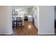 Modern kitchen with white cabinets, stainless steel appliances, and hardwood floors at 3594 Vinyard Way, Lawrenceville, GA 30044