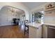 Open concept kitchen featuring wood floors and access to additional rooms at 3594 Vinyard Way, Lawrenceville, GA 30044