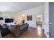 Bright living room featuring modern furnishings, hardwood floors, and an open floor plan at 3594 Vinyard Way, Lawrenceville, GA 30044