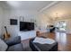 Open-concept living room with hardwood floors, modern lighting, and access to a patio at 3594 Vinyard Way, Lawrenceville, GA 30044