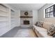 Inviting living room with stone fireplace, built-in shelving, and comfortable seating area at 3594 Vinyard Way, Lawrenceville, GA 30044