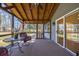 Inviting screened-in porch with cozy seating, ideal for enjoying the outdoors year-round at 3594 Vinyard Way, Lawrenceville, GA 30044
