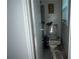 Tight bathroom in need of renovation showing a toilet, building materials, and small window at 676 Bralorne Dr, Stone Mountain, GA 30087