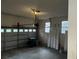 Garage features large door, several windows and a standard garage door opening mechanism at 676 Bralorne Dr, Stone Mountain, GA 30087