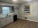 Well-lit kitchen featuring updated cabinets and modern fixtures at 676 Bralorne Dr, Stone Mountain, GA 30087
