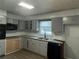 Functional kitchen featuring granite countertops and modern appliances at 676 Bralorne Dr, Stone Mountain, GA 30087