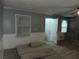 Cozy living room with a ceiling fan and natural light streaming through the windows at 676 Bralorne Dr, Stone Mountain, GA 30087