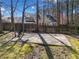 Backyard with a basketball court behind a wooden fence at 7104 Big Woods Dr, Woodstock, GA 30189