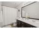 Double sink bathroom with a shower and tub at 7104 Big Woods Dr, Woodstock, GA 30189