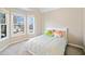 Cozy bedroom with a large window and plush carpeting at 7104 Big Woods Dr, Woodstock, GA 30189
