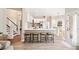 Open concept kitchen with an island, bar stool seating, and views into other rooms at 7104 Big Woods Dr, Woodstock, GA 30189