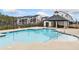 Community pool area with multiple apartment buildings in the background at 1053 Knoxboro Ln, Woodstock, GA 30188