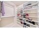 Walk-in closet with built-in shelves for optimal organization at 1053 Knoxboro Ln, Woodstock, GA 30188