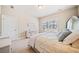 Neutral bedroom with plush carpet, great natural light, furniture, and closet door at 1053 Knoxboro Ln, Woodstock, GA 30188