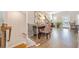 Open hallway with hardwood floors, staircase, and view of the dining area at 1053 Knoxboro Ln, Woodstock, GA 30188