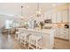 Bright kitchen with large island, pendant lighting, and stainless steel appliances at 1053 Knoxboro Ln, Woodstock, GA 30188