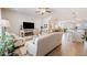 Open-concept living room and kitchen boasting lots of natural light and hardwood floors at 1053 Knoxboro Ln, Woodstock, GA 30188