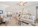 Bright living room with modern decor, leading to the kitchen and dining area at 1053 Knoxboro Ln, Woodstock, GA 30188