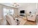 Inviting living room featuring a ceiling fan and a cozy fireplace at 1053 Knoxboro Ln, Woodstock, GA 30188