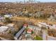 An aerial view shows the neighborhood with a pool and city skyline at 380 Grant Se Cir # 110, Atlanta, GA 30315