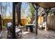Cozy backyard with brick patio, lounge chairs, and fire pit at 380 Grant Se Cir # 110, Atlanta, GA 30315