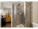 Bright, tiled shower in a bathroom, next to a bedroom at 380 Grant Se Cir # 110, Atlanta, GA 30315