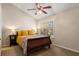 Comfortable bedroom featuring a wooden sleigh bed and natural light from a window at 380 Grant Se Cir # 110, Atlanta, GA 30315