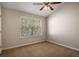 Bright, open room with neutral carpet and natural light from a large window at 380 Grant Se Cir # 110, Atlanta, GA 30315