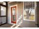 Inviting exterior porch with a red door, window, and screen door at 380 Grant Se Cir # 110, Atlanta, GA 30315