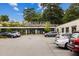 Commercial complex featuring the sign 'Artist Cove,' with multiple retail or office spaces in a well-maintained parking area at 380 Grant Se Cir # 110, Atlanta, GA 30315