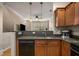 Bright kitchen offering wood cabinets, breakfast bar, and stainless steel appliances at 380 Grant Se Cir # 110, Atlanta, GA 30315