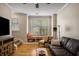 Inviting living room with a window seat, hardwood floors, and cozy furnishings at 380 Grant Se Cir # 110, Atlanta, GA 30315