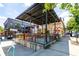 Inviting outdoor seating area with colorful chairs and a covered patio, perfect for enjoying food and drinks at 380 Grant Se Cir # 110, Atlanta, GA 30315