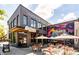 Cozy outdoor dining space with metal chairs, tables and mural wall providing a welcoming ambiance for guests at 380 Grant Se Cir # 110, Atlanta, GA 30315