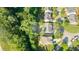 An aerial view highlights property lines of a house surrounded by trees and landscaping in a residential area at 4770 Shiloh Springs Rd, Cumming, GA 30040
