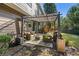 Private backyard with a covered patio and comfortable seating, ideal for outdoor living at 4770 Shiloh Springs Rd, Cumming, GA 30040