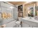 Bright bathroom with a shower-tub combo and a modern vanity with framed mirror at 4770 Shiloh Springs Rd, Cumming, GA 30040