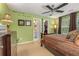 A bedroom with natural light, ceiling fan, and en-suite bathroom at 4770 Shiloh Springs Rd, Cumming, GA 30040