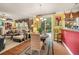 Bright dining area with hardwood floors, bar seating and seamless view of the living room at 4770 Shiloh Springs Rd, Cumming, GA 30040