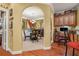 Inviting dining room with arched entryways and a view of the office nook at 4770 Shiloh Springs Rd, Cumming, GA 30040