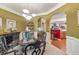 Elegant dining room with arched entryways, a glass table and views of the kitchen at 4770 Shiloh Springs Rd, Cumming, GA 30040