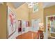 Spacious foyer with gleaming hardwood floors, a high ceiling, and a view into adjacent rooms at 4770 Shiloh Springs Rd, Cumming, GA 30040