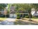 Beautiful home with a two-car garage, lush landscaping, and a welcoming front porch at 4770 Shiloh Springs Rd, Cumming, GA 30040