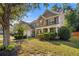 Lovely home featuring stone accents, a well-kept lawn, and a covered front porch at 4770 Shiloh Springs Rd, Cumming, GA 30040