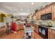 Open kitchen featuring granite countertops, breakfast bar, and black appliances at 4770 Shiloh Springs Rd, Cumming, GA 30040