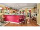 Stylish kitchen featuring a breakfast bar, modern appliances, and an adjacent dining space at 4770 Shiloh Springs Rd, Cumming, GA 30040