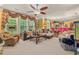 Open living area with large windows, view of the kitchen and an adjacent dining area at 4770 Shiloh Springs Rd, Cumming, GA 30040