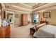 Main bedroom featuring a coffered ceiling, carpet floors and walk-in closet at 4770 Shiloh Springs Rd, Cumming, GA 30040