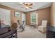 Office features neutral walls, a ceiling fan, and a desk with a chair at 4770 Shiloh Springs Rd, Cumming, GA 30040